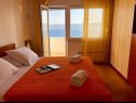 Apartementen Paradiso with gorgeous sea view: A1 Doris (4+2), SA2 Petra (2+2), SA3 Nina (2) Lokva Rogoznica - Riviera Omis  - Appartement - A1 Doris (4+2): slaapkamer